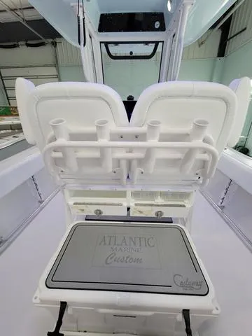 Slide: The Image of 2025 Sportsman Heritage 231 boat interior with custom seating and rod holders. - 32