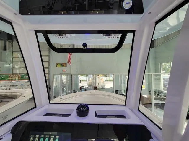 Slide: The Image of Interior view of 2025 Sportsman Heritage 231 boat cockpit with modern controls. - 36