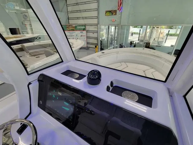 Slide: The Image of Interior view of 2025 Sportsman Heritage 231 boat dashboard with navigation equipment. - 39