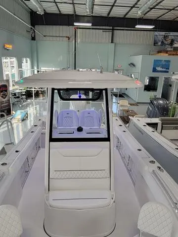 Slide: The Image of 2025 Sportsman Heritage 231 boat in showroom, featuring sleek design and modern amenities. - 40