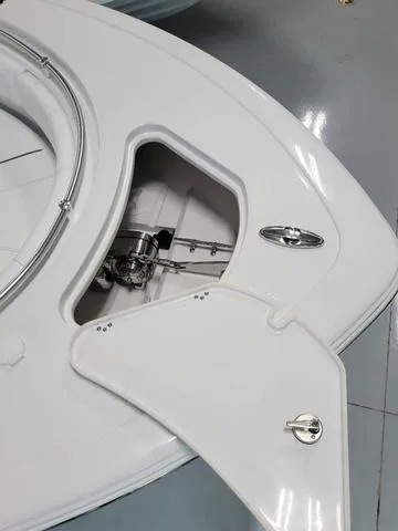 Slide: The Image of 2025 Sportsman Heritage 231 boat anchor compartment with open hatch. - 45