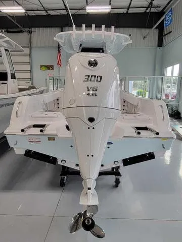 Slide: The Image of 2025 Sportsman Heritage 231 boat with powerful 300 V6 engine in showroom. - 49