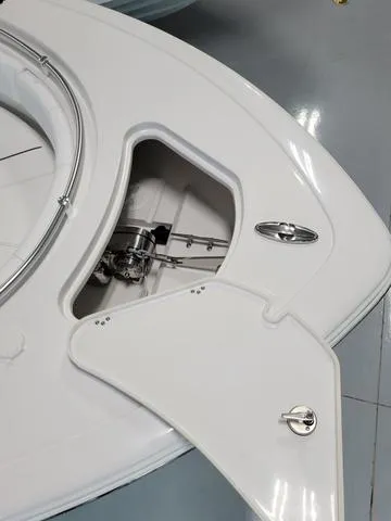 Slide: The Image of 2025 Sportsman Heritage 231 boat anchor compartment with open hatch. - 6