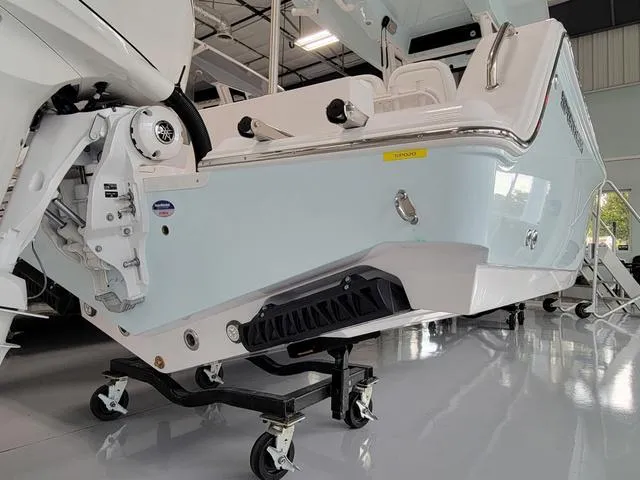 Slide: The Image of 2025 Sportsman Heritage 231 boat in showroom, showcasing sleek design and modern features. - 9