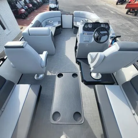 Slide: The Image of 2025 Veranda Vista Sport 20 RC boat interior with modern seating and steering console. - 11