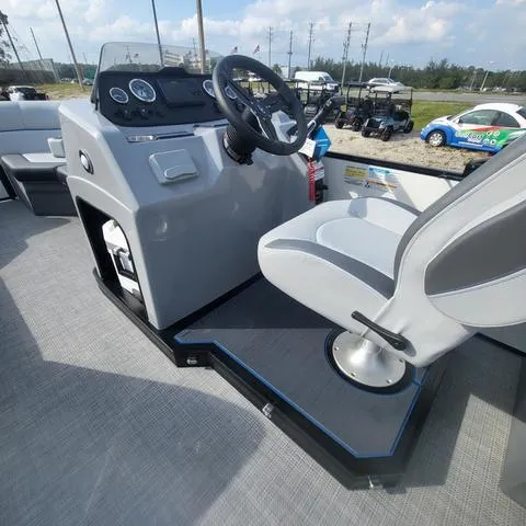 Slide: The Image of 2025 Veranda Vista Sport 20 RC boat cockpit with steering wheel and captain's chair. - 12