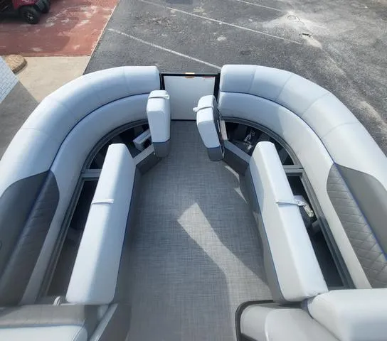 Slide: The Image of 2025 Veranda Vista Sport 20 RC boat interior with gray seating and spacious layout. - 19