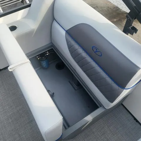 Slide: The Image of 2025 Veranda Vista Sport 20 RC boat seat with storage compartment open. - 21