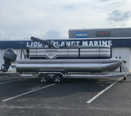 Slide: The Image of 2025 Veranda Vista Sport 20 RC pontoon boat on trailer at marine dealership. - 3
