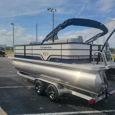 Slide: The Image of 2025 Veranda Vista Sport 20 RC pontoon boat on trailer in parking lot. - 6