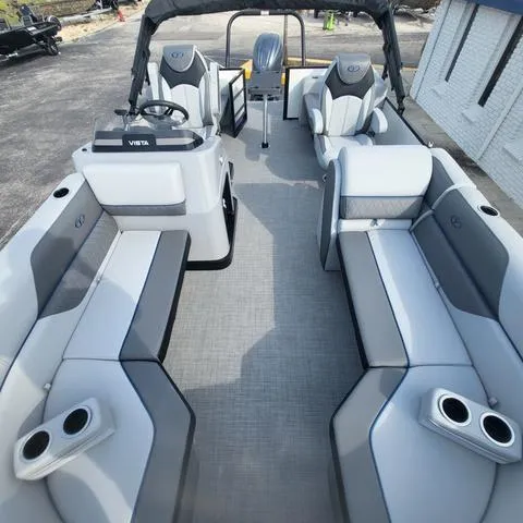 Slide: The Image of 2025 Veranda Vista Sport 20 RC pontoon boat interior with modern seating and steering console. - 8