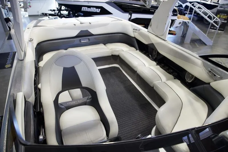Slide: The Image of 2016 Malibu 23 LSV boat interior with luxurious seating and modern design. - 10