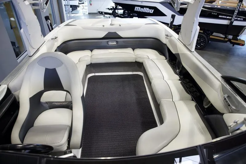 Slide: The Image of 2016 Malibu 23 LSV boat interior with luxurious seating and modern design. - 13