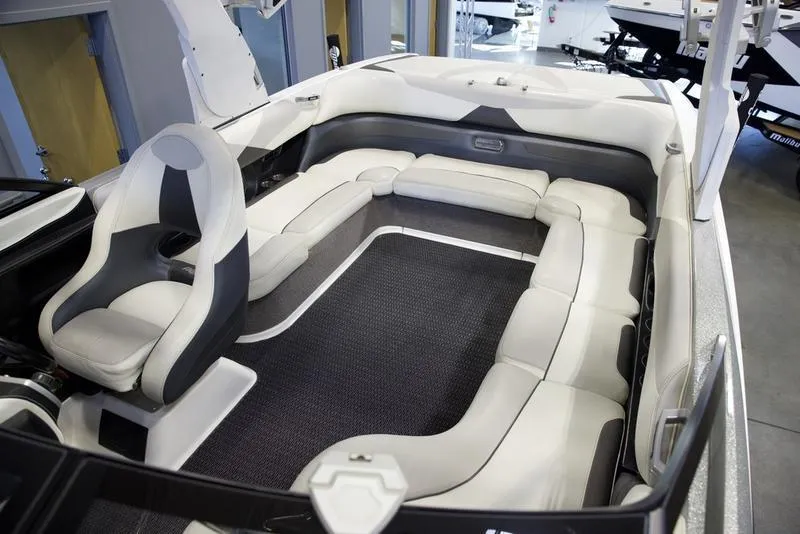 Slide: The Image of 2016 Malibu 23 LSV boat interior with spacious seating and modern design. - 14