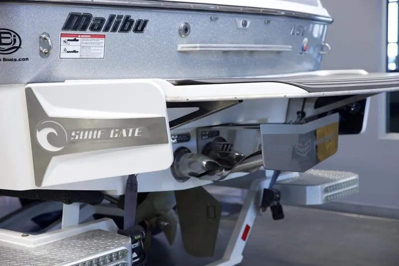 Slide: The Image of 2016 Malibu 23 LSV boat with Surf Gate technology, rear view. - 4