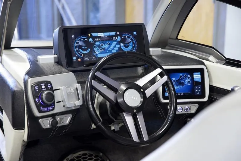 Slide: The Image of 2016 Malibu 23 LSV dashboard with modern controls and digital displays. - 5