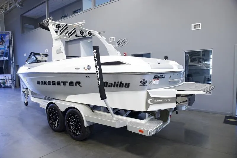Slide: The Image of 2016 Malibu 23 LSV Wakesetter boat on trailer in showroom. - 6