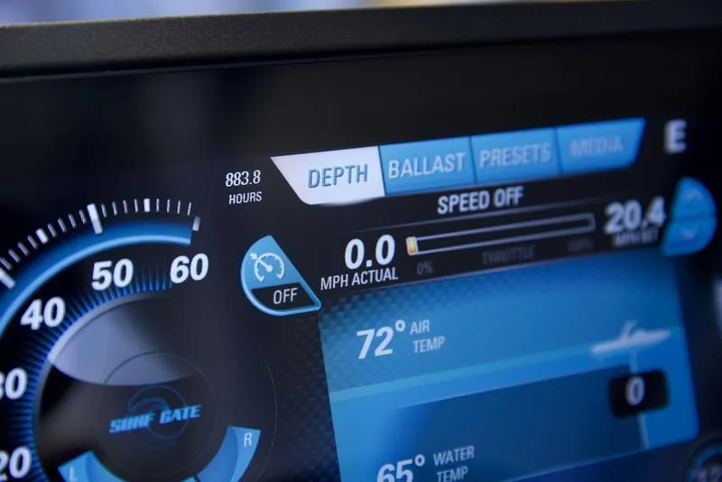 Slide: The Image of Close-up of 2016 Malibu 23 LSV dashboard display showing speed and temperature settings. - 8