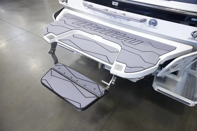 Slide: The Image of 2025 Malibu 22 MXZ swim platform with step, featuring sleek design and durable materials. - 4