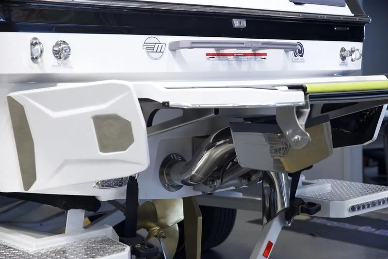 Slide: The Image of 2025 Malibu 22 MXZ boat rear view, showcasing exhaust and platform details. - 5