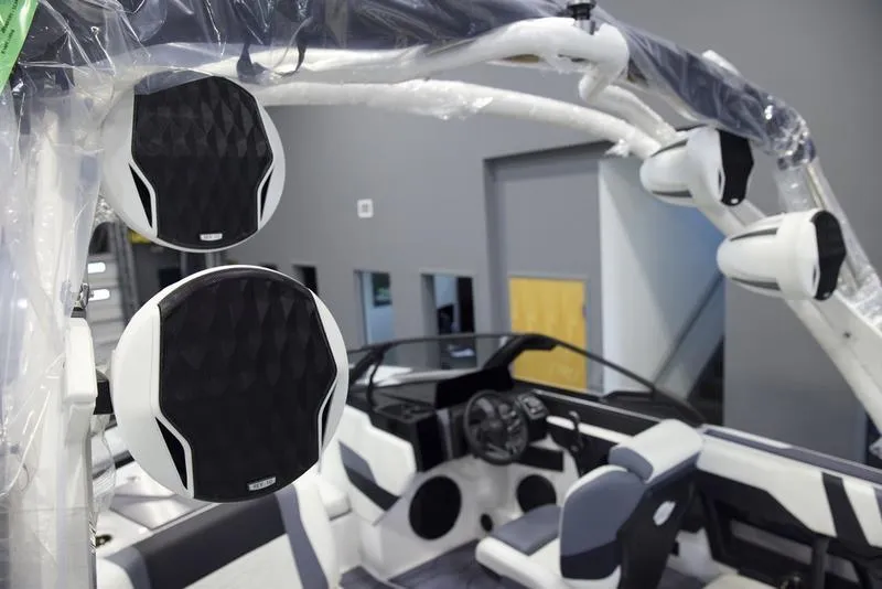 Slide: The Image of 2025 Malibu 22 MXZ boat interior with premium audio system and modern design. - 6