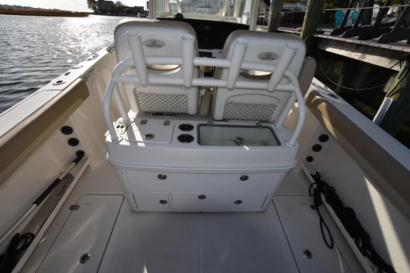 Slide: The Image of 2020 Sailfish 290 CC boat interior with seating and storage compartments. - 17
