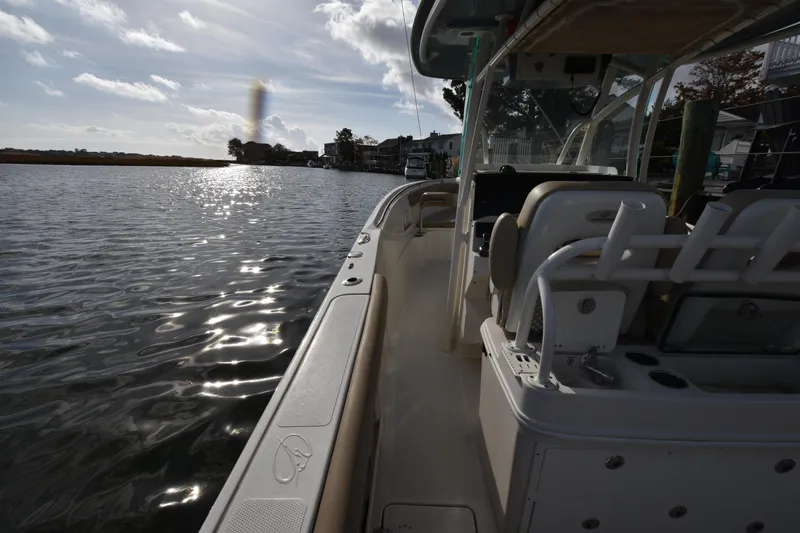 Slide: The Image of Sailfish 290 CC boat on calm water, 2020 model, sunny day. - 38