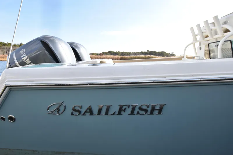 Slide: The Image of 2020 Sailfish 290 CC boat with Yamaha engines, side view. - 41