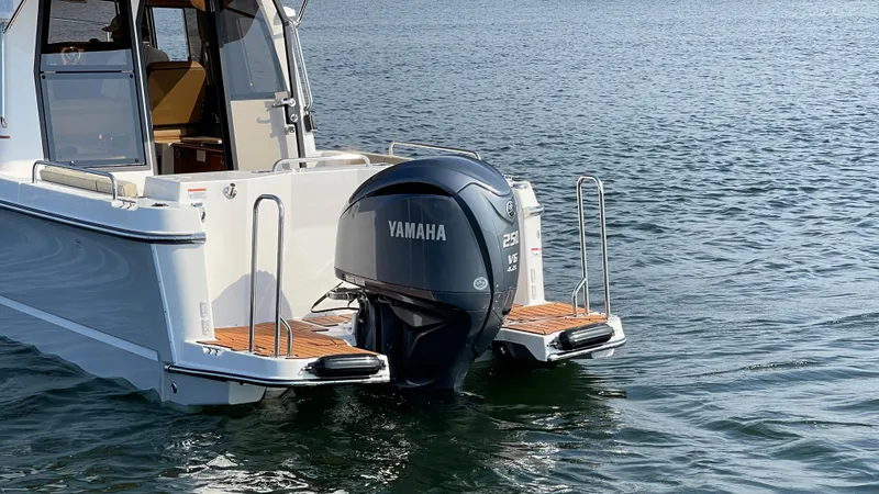 Slide: The Image of 2025 Ranger Tugs R-25 with Yamaha outboard motor on water. - 18