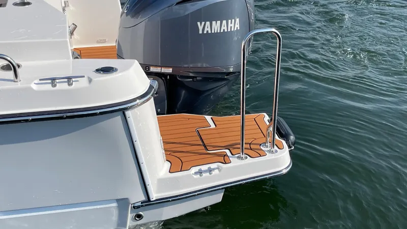 Slide: The Image of 2025 Ranger Tugs R-25 boat with Yamaha motor and teak swim platform. - 28