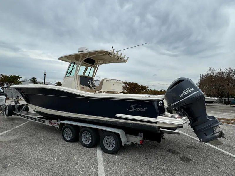 Slide: The Image of 2011 Scout 282 XSF boat on trailer with Yamaha outboard motor. - 1