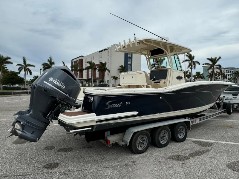 Slide: The Image of 2011 Scout 282 XSF boat on trailer with Yamaha outboard motor. - 2