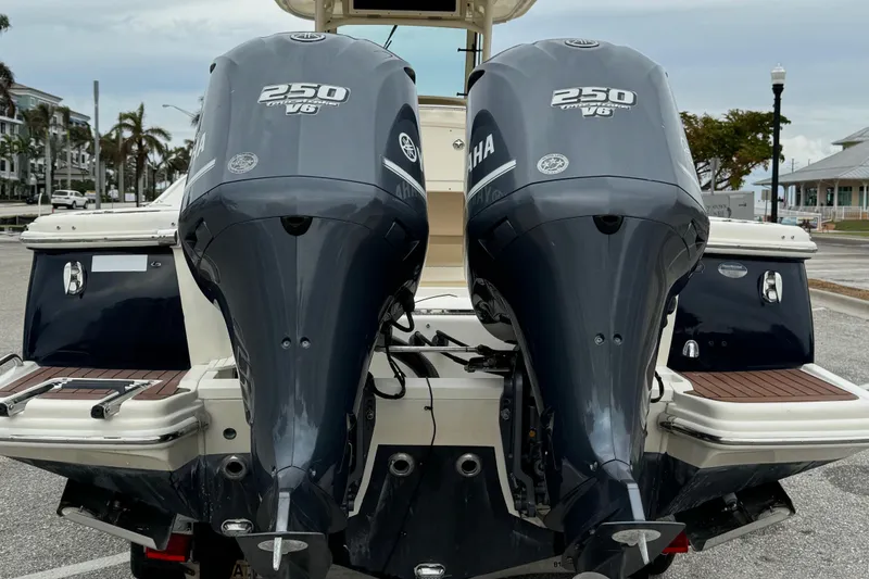 Slide: The Image of 2011 Scout 282 XSF boat with twin 250 V6 engines at dock. - 5