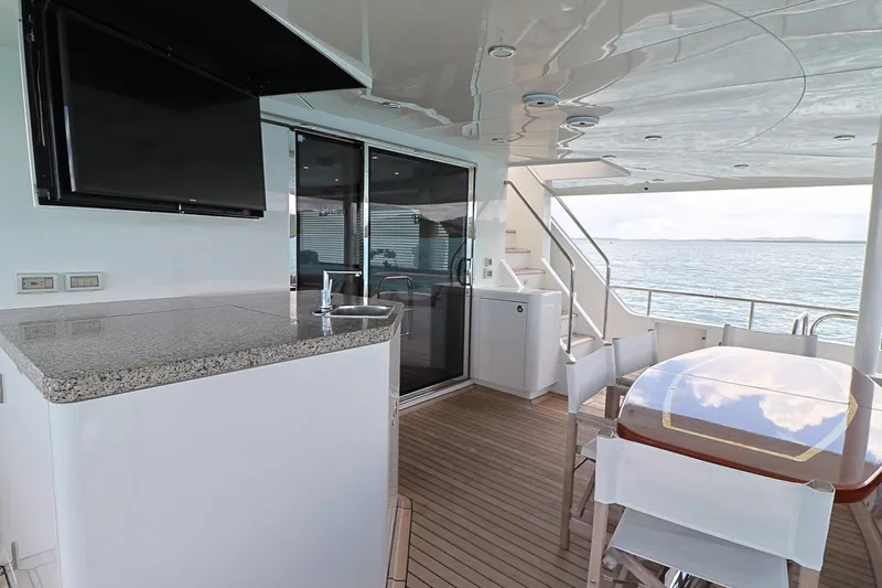 Slide: The Image of Luxurious 2013 Cheoy Lee Bravo yacht deck with dining area and ocean view. - 14