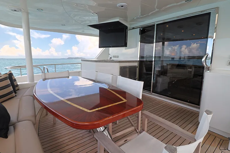 Slide: The Image of Luxury deck of 2013 Cheoy Lee Bravo yacht with elegant dining area and ocean view. - 15