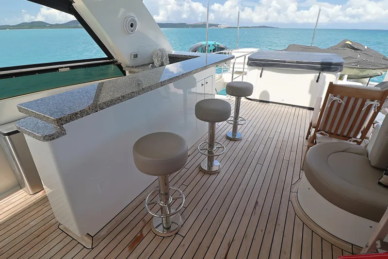 Slide: The Image of Luxurious 2013 Cheoy Lee Bravo yacht deck with bar stools and ocean view. - 22