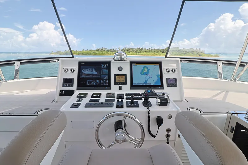 Slide: The Image of Helm of 2013 Cheoy Lee Bravo yacht with navigation screens and ocean view. - 25
