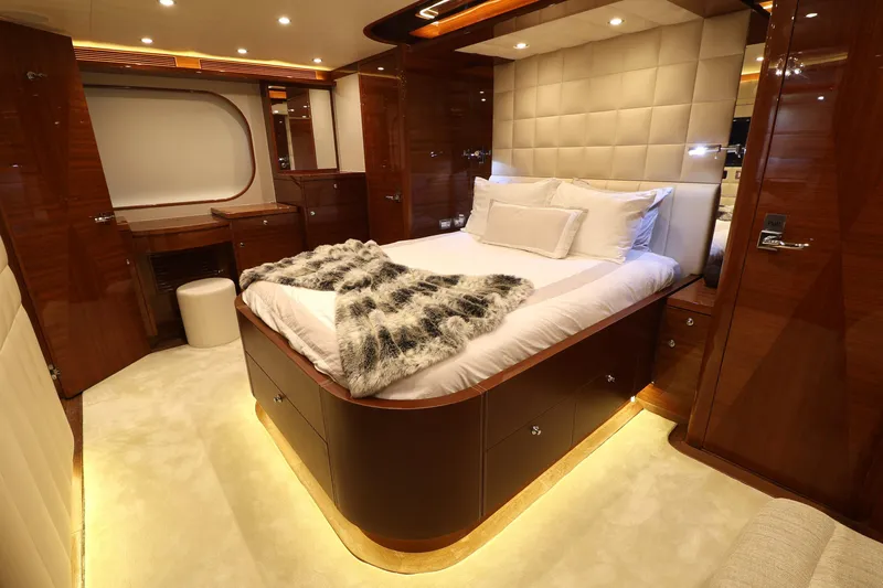 Slide: The Image of Luxurious 2013 Cheoy Lee Bravo yacht bedroom with elegant wood finishes and ambient lighting. - 36