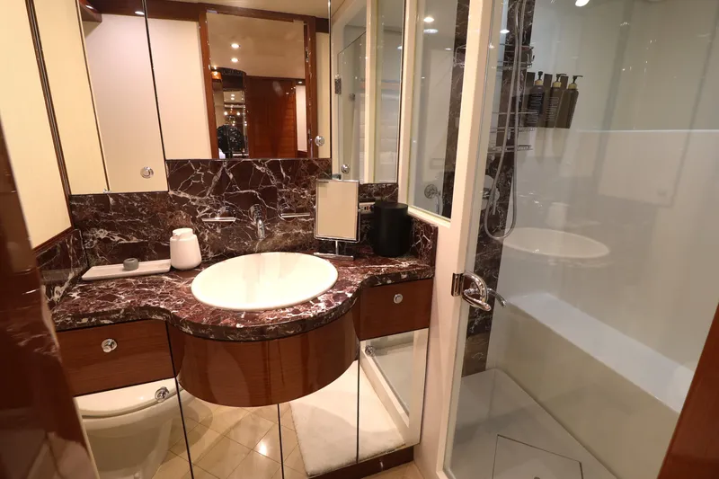 Slide: The Image of Luxurious bathroom in 2013 Cheoy Lee Bravo yacht with marble countertop and glass shower. - 39