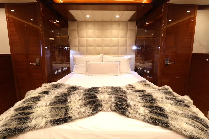 Slide: The Image of Luxurious bedroom interior on 2013 Cheoy Lee Bravo yacht with plush bedding and elegant wood finishes. - 41