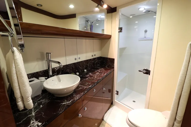Slide: The Image of Luxurious bathroom in 2013 Cheoy Lee Bravo yacht with marble countertop and modern fixtures. - 48