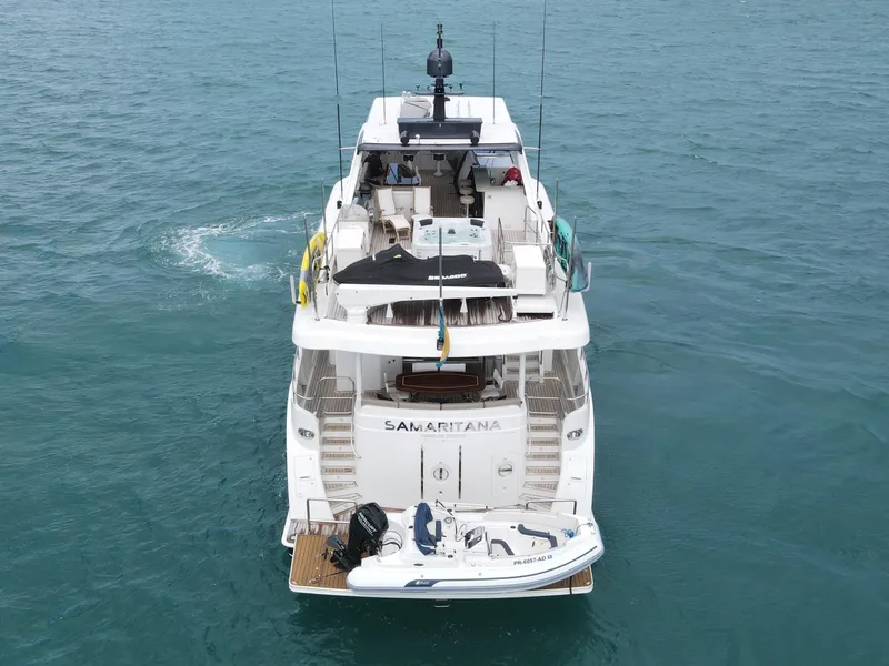 Slide: The Image of 2013 Cheoy Lee Bravo yacht on water, rear view with small boat attached. - 6