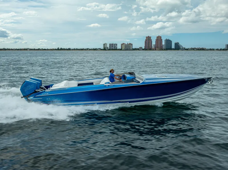 Slide: The Image of 2024 Nor-Tech 360 Monte Carlo Flyer speeding on water, city skyline in background. - 15