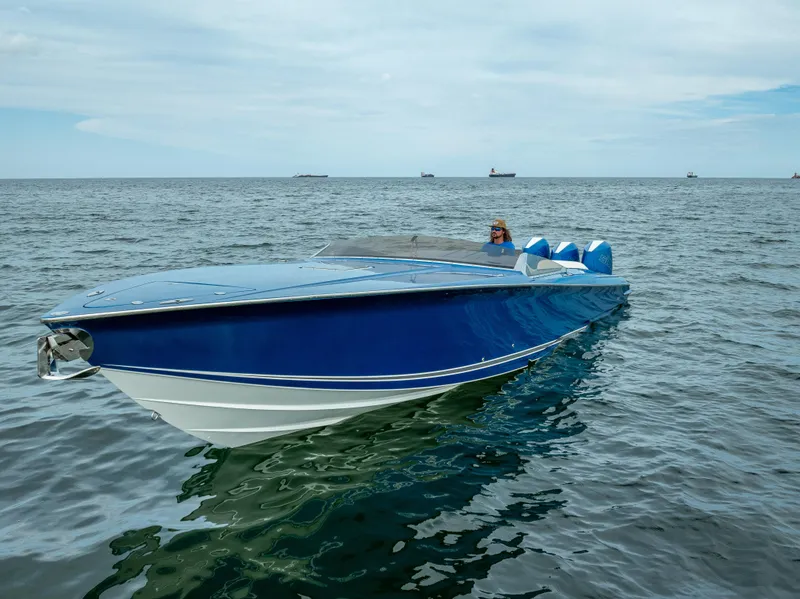 Slide: The Image of 2024 Nor-Tech 360 Monte Carlo Flyer, sleek blue design on open water. - 30
