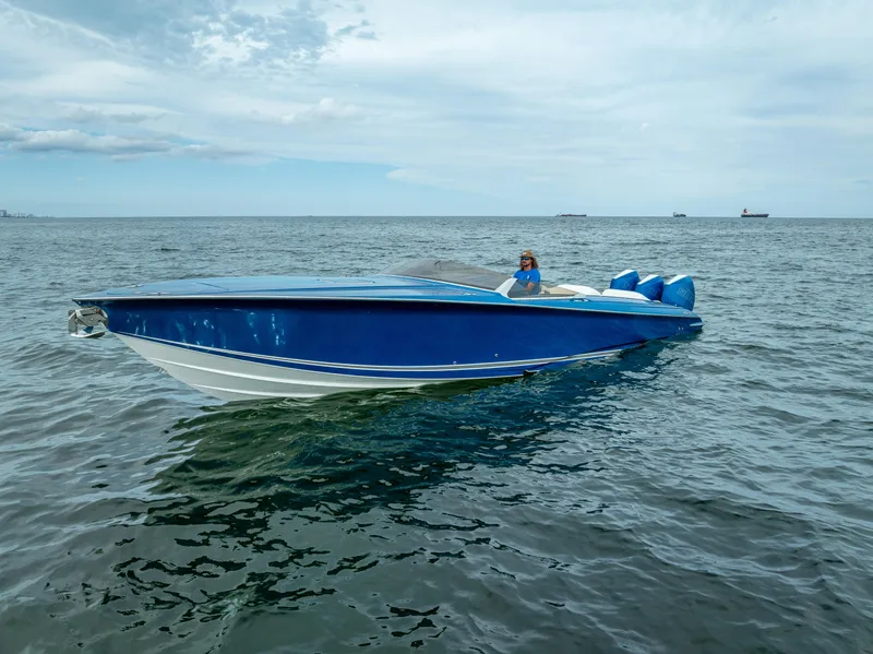 Slide: The Image of 2024 Nor-Tech 360 Monte Carlo Flyer in blue on open water. - 31