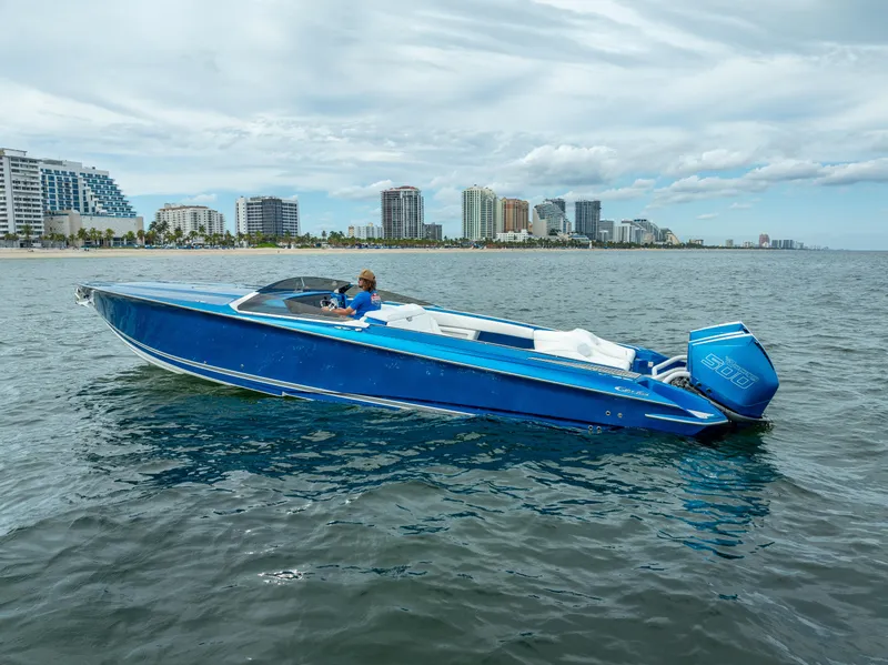 Slide: The Image of 2024 Nor-Tech 360 Monte Carlo Flyer boat cruising near city skyline. - 32