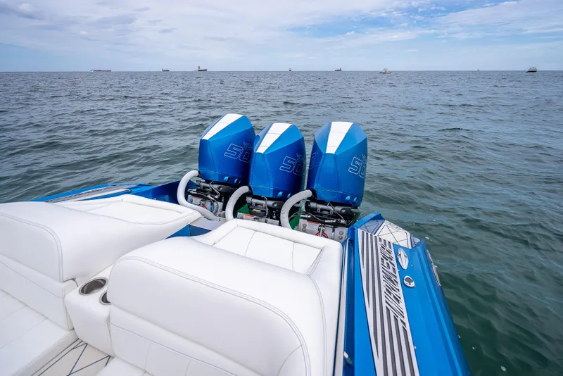 Slide: The Image of 2024 Nor-Tech 360 Monte Carlo Flyer with triple engines on open water. - 41