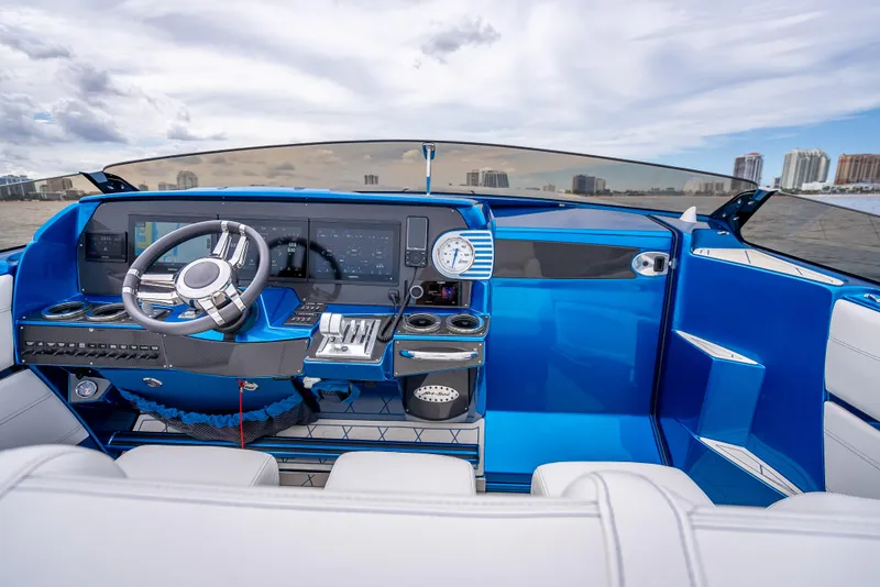 Slide: The Image of 2024 Nor-Tech 360 Monte Carlo Flyer cockpit with modern controls and blue interior. - 8