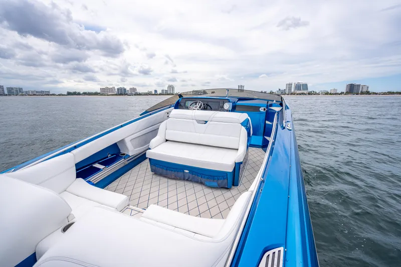 Slide: The Image of 2024 Nor-Tech 360 Monte Carlo Flyer boat with luxurious seating on open water. - 38