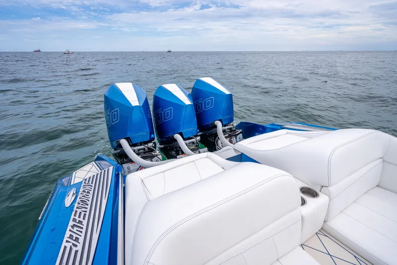 Slide: The Image of 2024 Nor-Tech 360 Monte Carlo Flyer with triple engines on open water. - 40